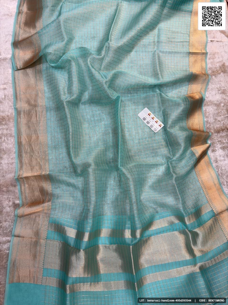 Pure handloom Banarasi Kora saree featuring Kaduwa golden zari work. The saree comes with a blouse that has a border and checks design. Smooth and soft fabric, certified with Silk Mark.